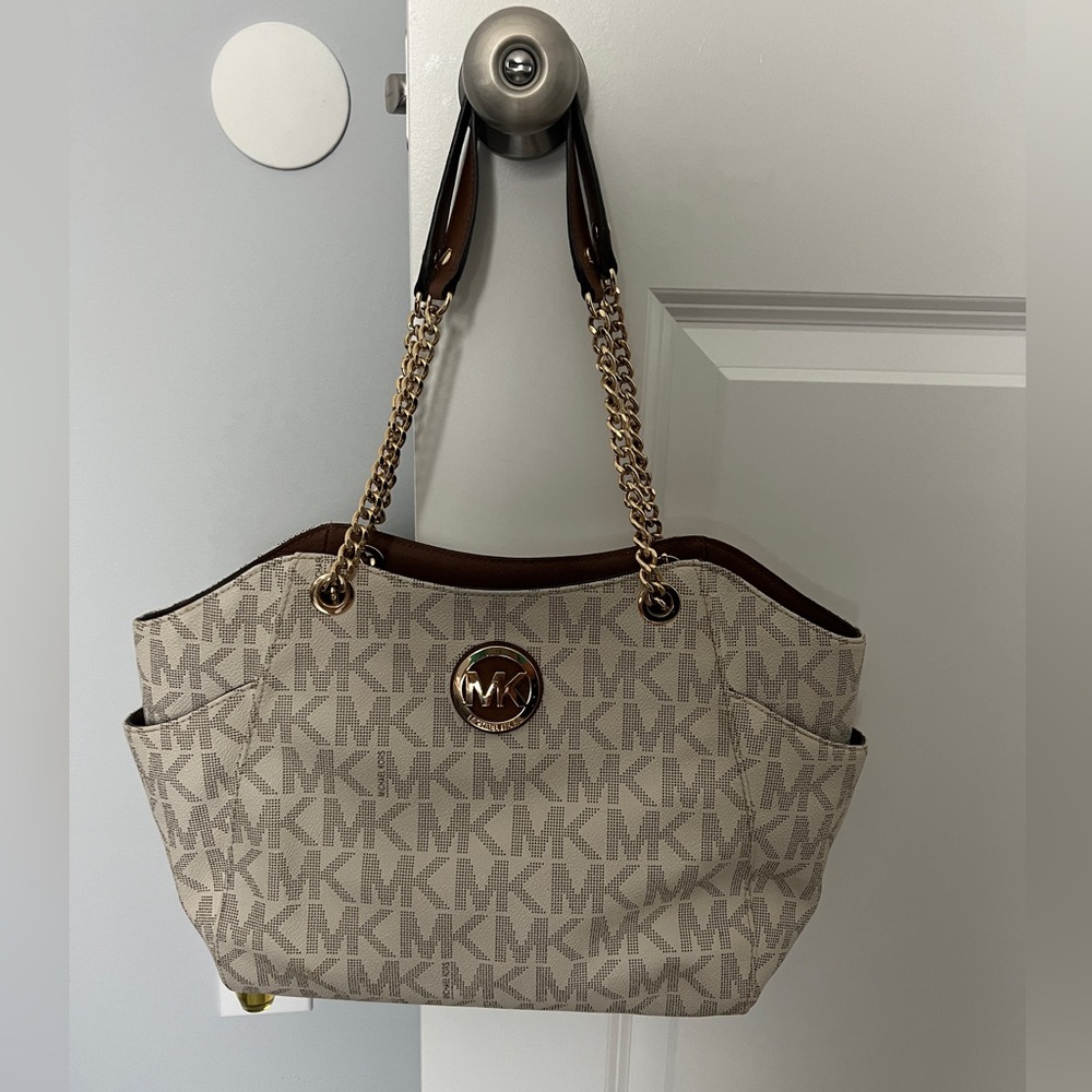 Brown and white Micheal  kors